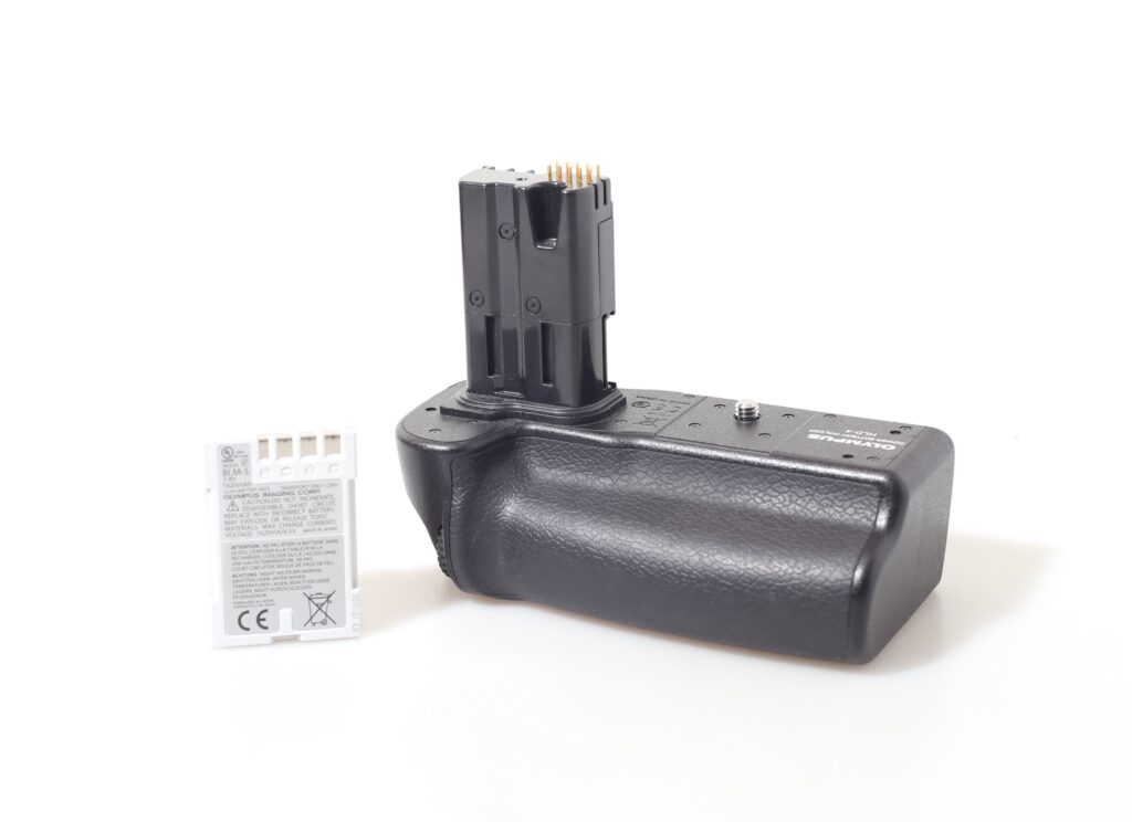 POWER BATTERY HOLDER OLYMPUS HLD-4+BLM-5. E-30, E-3, E-5.